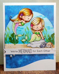 a card with two little mermaids hugging each other on the bottom, and texting we're mermaid for each other