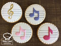 four decorated cookies with musical notes on them