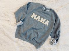 If you're a mama or have a special mama in your life, you need this sweatshirt! The perfect mix of sass and comfy! Letter colors are white, pink, or black as pictured, all color options have gold glitter border. The standard sweatshirt color for this listing is grey. If another color sweatshirt is desired, please message me prior to ordering to discuss options. The patches are heat pressed and all designs are hand placed. Gildan brand Unisex sizing Adult S-2XL Sweatshirt is 50% cotton, 50% polye Kids Soccer Team, Color Sweatshirt, Chenille Patch, Reverse Tie Dye, Varsity Letter, Bleach Dye, Sweatshirt White, Fabric Glue, Mama Sweatshirt