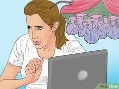 a woman sitting in front of a laptop computer