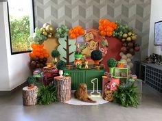 a lion themed birthday party with balloons and decorations