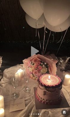 a table topped with a cake and candles