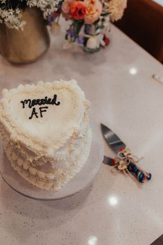 This heart-shaped wedding cake adorned with the playful "Married AF" message perfectly represents the fun-loving spirit of this LGBTQ+ couple's wedding day. Surrounded by vibrant florals and set against the intimate ambiance of the Dallas Botanical Gardens, this cake is a sweet reminder of their love-filled celebration. Dive into their story on the blog and explore more LGBTQ+ wedding inspiration. Dallas Botanical Gardens, Alternative Elopement, Butterflies Tattoos, Heart Shaped Wedding Cakes, Rainbow Wedding Cake, Butterfly Release, Wedding Cake Design, Dallas Arboretum