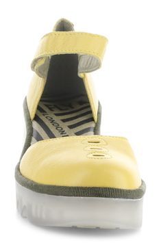 The classic mary jane is elevated on a sawtooth-soled platform wedge for this cushioned leather pump. 3" heel; 1" platform Adjustable hook-and-loop strap Cushioned insole Leather upper and lining/rubber sole Made in Portugal Women's Shoes Yellow Wedges, Wedge Pump, Fly London, Wedge Pumps, Platform Wedge, Leather Pumps, Platform Wedges, Women's Pumps, Wedge Shoes