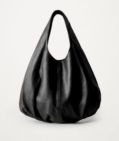 Large black leather slouch bag for women. This minimalist black the pouch is crafted from butter-soft italian leather. Very practical for carrying on the shoulder or in the hand. The purse closes with a magnetic closure. Inside there is one zippered pocket. Spacious interior provides room for all the daily essentials. This bag is perfect as your everyday bag, which can fit an iPad, books, magazines, cosmetic bag as well as many accessories. We have a variety of color options this bag. The bag is Versatile Black Textured Leather Hobo Bag, Black Vegetable-tanned Bags For Daily Use, Chic Black Smooth Grain Hobo Bag, Chic Black Hobo Bag With Smooth Grain, Black Smooth Grain Hobo Bag For Daily Use, Black Leather Hobo Bag With Smooth Grain, Modern Black Hobo Bag With Smooth Grain, Minimalist Leather Hobo Bag For Travel, Leather Minimalist Hobo Bag For Travel