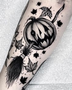 a black and white image of a pumpkin with leaves on it's leg, done by person