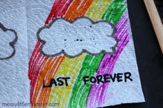 a piece of paper with the words last forever on it and a drawing of a rainbow