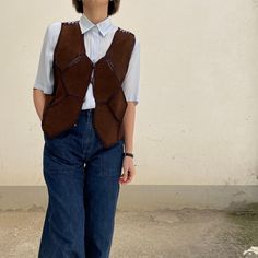 Vintage 70's Dark Brown Suede Leather Vest Short vest, very special, reversible: on both sides the vest is identical and the buttons can be turned on both sides Mesh vest in lightweight fabric and suede patch the label has been removed Recommended size International from S to M - Italian from 40 to 44 / European from 36 to 40 The girl in the photo wears Italian size 40 / European size 36 / international size S Measurements in cm: Shoulders 34 chest (pit-pit) 48 length 43 General conditions: vint Brown Leather Vest, Waistcoat Outfit, Vest Outfits For Women, Vintage Leather Vest, Women Leather Vest, Mesh Vest, Waistcoat Woman, Leather Waistcoat, Suede Shorts