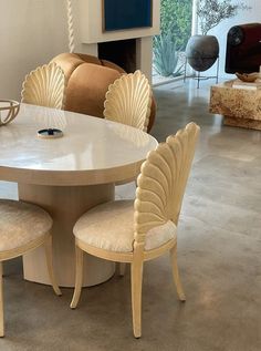 a dining room table with chairs around it