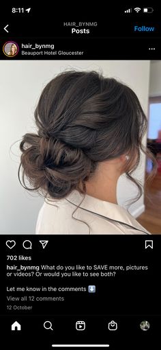 the back of a woman's head with her hair styled in a low bun