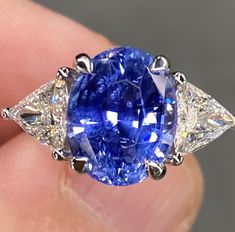 ALL THESE PHOTOS WERE TAKEN WITH AN ORDINARY IPHONE AND HAVE NOT BEEN EDITED OR ENHANCED IN ANY WAY. VIDEO LINKS: https://youtube.com/shorts/7GEBLdIi0K8?feature=share Up for sale is a Spectacular GIA Certified Unheated 6.8 Ctw Vibrant Blue Ceylon Sapphire & VVS Diamond Platinum Ring. This ring was Made by Us Here in New York City & is of the Finest Quality. The Center Stone is a Beautifully Faceted GIA Certified 5.72 Ct Oval Cut Blue Sapphire that Measures approx 11 x 9 mm, was mined in Ceylon ( Luxury Blue Pear-shaped Sapphire Ring, Gia Certified Blue Diamond Gemstones, Luxury Blue Pear-shaped Ring, Gia Certified Oval Blue Gemstones, Oval Blue High Luster Jewelry, Luxury Blue Trillion-cut Sapphire Ring, Luxury Blue Trillion Cut Sapphire Ring, Diamond Ring Platinum, Jewelry Knowledge