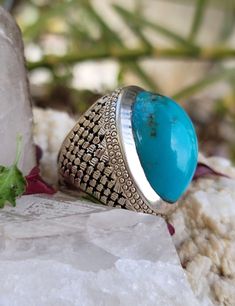 Description Natural Turquoise Stone famously known as Feroza Stone Men's Ring This Sterling Silver Ring is a perfect gift for men. The ring showcases an elegant design with Natural Turquoise Stone Large Gemstone. Get it for your loved one, or treat yourself for a classic timeless style. Since these stones are natural stones, we cannot guarantee stone texture you will receive. Stone maybe have different texture as you can see from photos. All our work is custom made by hand with Love and Care in our workshop. Please mention us your size. We will do our best to obtain it from our warehouse or resize when possible. Ring size : Please try to get your finger sized if you do not know your ring size. I strongly suggest having a professional jeweler determine your ring size for the width of the ri Luxury Turquoise Engraved Jewelry, Luxury Engraved Turquoise Jewelry, Luxury Silver Turquoise Ring With Gemstone, Luxury Oval Turquoise Ring For Gift, Luxury Oval Turquoise Ring Gift, Luxury Turquoise Ring As A Gift, Formal Handmade Turquoise Ring, Spiritual Turquoise Ring With Natural Stones, Bohemian Engraved Turquoise Ring For Gift