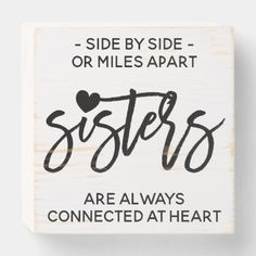 a wooden sign that says sisters are always connected at heart on the side by side or miles apart