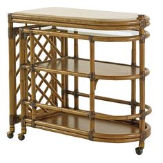 an antique bamboo bar cart with marble top