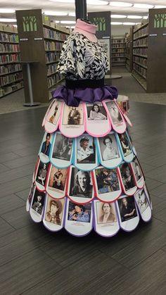 a dress made out of photos in a library