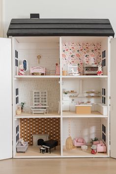 a doll house with all the furniture and accessories in it's display case,