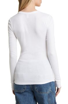 A stretchy rib knit perfects the figure-hugging fit of this lithe, long-sleeve T-shirt. 25 1/2" length (size Medium)   Crewneck   Long sleeves   97% Lenzing™ EcoVero™ viscose, 3% spandex   Lenzing EcoVero viscose is a sustainably produced fiber using pulp made from renewable wood sources and certified with the EU Ecolabel for high environmental standards, including lower emissions and water usage than generic viscose   Hand wash, dry flat   Imported   Not available for sale and shipment to Germa White Fitted Top For Winter, Fitted Ribbed Long Sleeve T-shirt, Fitted Long Sleeve Ribbed T-shirt, White Long Sleeve Stretch Top With Thumbholes, White Long Sleeve Top With Stretch And Thumbholes, White Stretch Long Sleeve Top With Thumbholes, Fitted White Ribbed Long Sleeve Top, Fitted White Long Sleeve Ribbed Top, Ribbed Stretch Long Sleeve Top With Crew Neck