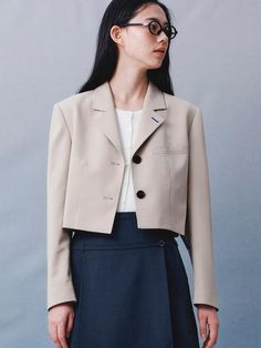 This product is a signature side slit short jacket that adds a contemporary flair to a classic design. The jacket features notched lapels and a button-front closure, while the side slits introduce a unique, modern touch. The shorter length of the jacket makes it a versatile layering piece that can be worn with a variety of outfits for different occasions. - The side slits in the jacket provide a chic and edgy detail, enhancing the garment's overall style.- Its notched lapels give a nod to traditional tailoring, making the jacket suitable for both formal and casual looks.- The short cut of the jacket allows for easy pairing with high-waisted pants or skirts, offering a flattering silhouette.- Crafted with a focus on fit and form, the jacket is as comfortable as it is fashionable. Beige Short Jacket Outfit, Edge Outfits, Short Jacket Outfit, Outfits For Different Occasions, Edgy Outfits For Women, Summer Coats, Jacket Beige, Short Cut, Tailored Blazer