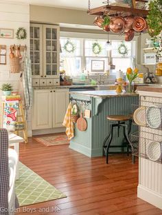 a kitchen filled with lots of furniture and decor