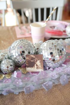 disco ball decorations on a table at a party