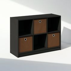 a black shelf with four brown bins on it