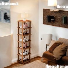 a living room filled with furniture and a lamp on top of a wooden book shelf