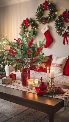 a table with candles and christmas decorations on it