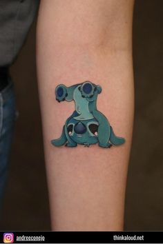 a person with a tattoo on their arm that has a dog sitting on top of it