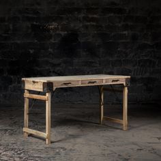 an old wooden desk with two drawers on one side and a drawer on the other