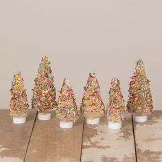 there are many small trees made out of sprinkles on top of each other