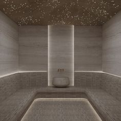 an empty bathroom with white walls and tile flooring is lit up by lights on the ceiling