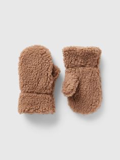 Soft, cozy sherpa mittens.  These mittens are made with 50% recycled polyester.  Compared to virgin materials, using recycled materials helps to reduce resource use and waste.  This product was made in a factory that runs the Gap Inc.  P. A. C. E.  Personal Advancement & Career Enhancement) program.  P. A. C. E.  is our educational program that helps the women who make our clothes build the skills, knowledge, confidence & resilience needed to advance in work & life.  Learn more here.  For more f Sherpa Mittens, Toddler Mittens, Infant Hat, Toddler Accessories, Family Event, Toddler Boy Outfits, Boy Clothes