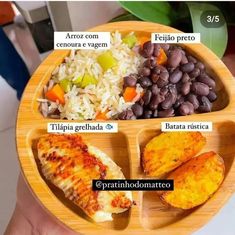 a person holding a wooden plate with different food items in it, including rice and beans