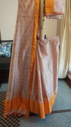 Welcome to our shop, where we take pride in offering you the finest craftsmanship and exquisite textiles. Introducing our pure Muga silk Mekhela Chador, a timeless masterpiece that beautifully combines tradition and elegance. Handwoven with care and precision, this Mekhela Chador is crafted from pure Muga silk, sourced from the silkworm Antheraea assamensis, which is indigenous to Assam, India. Muga silk is known for its lustrous golden hue, unparalleled sheen, and incredible durability. It is c Handloom Pre-draped Saree For Eid, Festive Cotton Silk Lehenga With Cutdana, Festive Cotton Silk Lehenga With Cutdana Detail, Bollywood Style Cotton Silk Lehenga With Cutdana, Traditional Art Silk Pre-draped Saree For Diwali, Unstitched Bollywood Lehenga In Cotton Silk, Traditional Lehenga With Zari Work In Cotton Silk, Unstitched Bollywood Style Cotton Silk Lehenga, Transitional Cotton Silk Lehenga With Zari Work