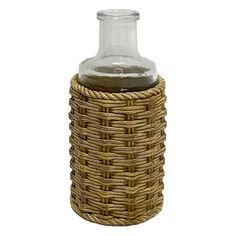 a bottle with some liquid in it sitting on a wicker basket next to a white background