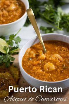 two bowls of soup on a cutting board with cilantro and limes in the background