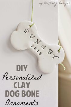 a dog bone ornament hanging on a white card with the words diy personalized clay dog bone ornaments