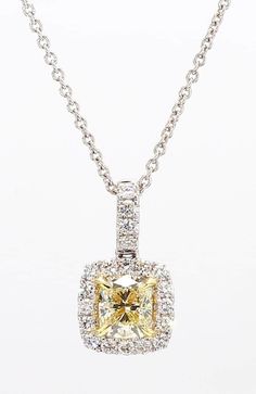 RareGemWorld's intriguing diamond pendant. Mounted in a beautiful 18K Yellow and White Gold setting with a natural cushion cut yellow diamond. The yellow diamond is surrounded by round natural white diamond melee. This pendant is guaranteed to impress and enhance your personal collection. Total Weight: 0.94cts Natural Cushion Light Yellow Diamond Natural Round White Diamonds 18K Yellow/White Gold All diamonds are guaranteed natural International Shipments: Please note that customers are responsible for all import duties and taxes applicable to the country of shipment Returns: Returns accepted in original format within 14 days of receipt Do not forget to view our entire inventory! Thank you for reviewing our item Light Yellow Diamond, Yellow Cushion, Yellow Cushions, Natural Cushions, White Gold Set, Cushion Diamond, Yellow Diamond, Drop Pendant, White Diamonds