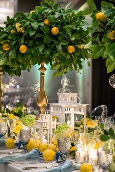 the table is set with lemons and silverware for an elegant dinnereon party