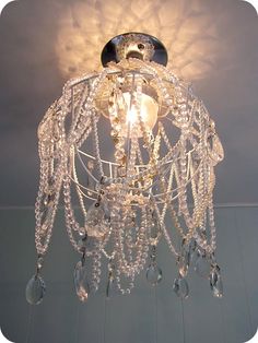 a chandelier hanging from the ceiling in a room