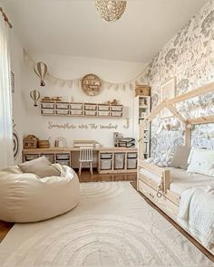 a bedroom with a bed, desk and shelves on the wall next to a window