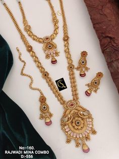 Description :- Long Choker Indian Traditional Wedding Bridal Wear Gold Plated Necklace Earrings Tika Kundan Diamond Fashion Jewelry Set 2 Piece Combo Set The biggest highlight of this manalis necklace set lies in its detailing. The designers at Tarinika have put meticulous attention to details in order to perfect the detailing of the unique and intricate design. The bead-like design of the necklace's chain fuses ethnic style with contemporary flairs. 100% Satisfaction Guarantee: 1 Year Warranty, Luxury 22k Gold Jewelry Sets With Intricate Design, Luxury 22k Gold Temple Bridal Necklace, Gold Peacock Design Jewelry Sets For Weddings, Temple Jewelry Sets With Peacock Design For Weddings, Gold Set Design, Indian Traditional Wedding, Necklace Set Indian Bridal Jewelry, Diamond Fashion Jewelry, Antique Gold Jewelry Indian