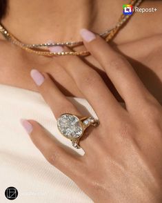 a woman's hand with a ring on it