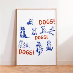 a framed poster with dogs on it in front of a white wall and wooden floor