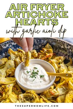 air fryer artichoke hearts with garlic aioli dip in a blue bowl