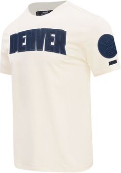 Support your Denver Nuggets in this White Short Sleeve Fashion Tee! This Triple Tonal Fashion T Shirt features a tonal team name embroidered across chest. Be ready to shout "Go Nuggets" when you wear this Denver Short Sleeve Fashion T Shirt in the stadium or on the street. Crew neckline, Unisex, Team graphics on chest and sleeves, Pro Standard branding on back collar, Comfortable fit, Fit: True to Size, Imported Collegiate Cotton T-shirt With Embroidered Graphics, Team-colored Tops With Embroidered Graphics For Fans, Varsity Cotton T-shirt With Embroidered Graphics, Team-colored Cotton Tops With Embroidered Graphics, Sports Cotton T-shirt With Embroidered Graphics, Sporty T-shirt With Embroidered Text For College, Crew Neck Top With Embroidered Logo For Fans, Team-colored Tops With Embroidered Logo For College, College Tops With Team-colored Embroidered Logo