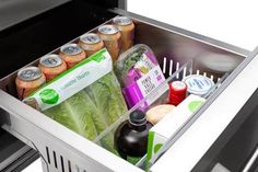 an open refrigerator filled with lots of food and drinks