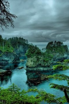 an image of a lake surrounded by trees and rocks with the caption cape flattery, washington