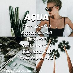 a woman standing next to two palm trees in front of a wall with the words aqua on it