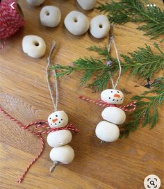 these snowman ornaments are made from wood beads and twined with twine string